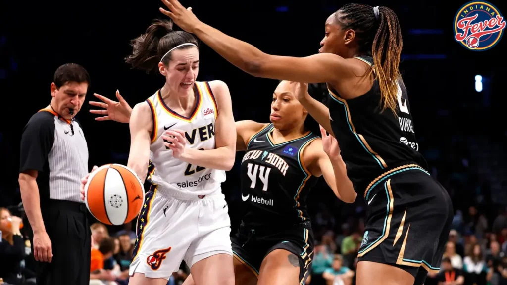 New York Liberty forwards Betnijah Laney-Hamilton (44) and Kennedy Burke (2) defend against Indiana Fever guard Caitlin Clark (22) during the first half of a WNBA basketball game, Saturday, May 18, 2024, in New York.
