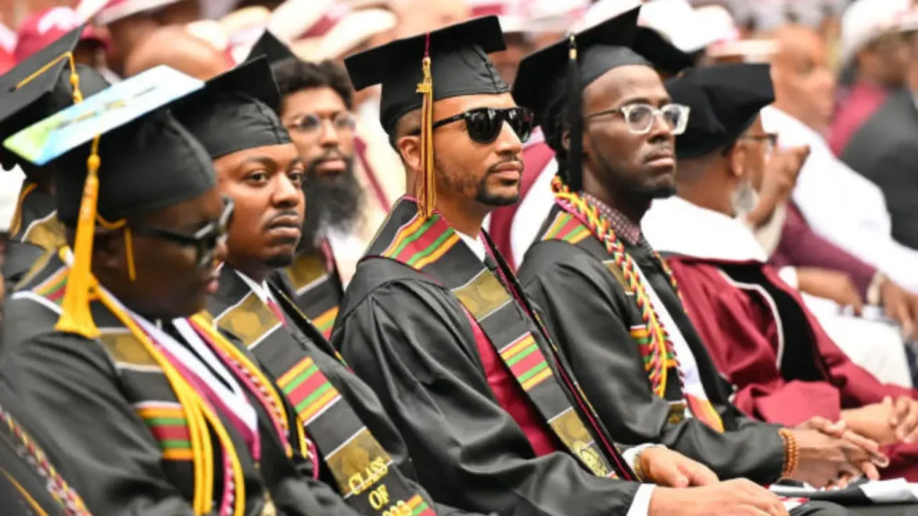 During the Morehouse College commencement ceremony on Sunday, May 19, 2024, graduating students bowed their heads in Atlanta as President Biden addressed them. He cautioned against "extremist forces" that he believes pose a threat to the nation's soul.