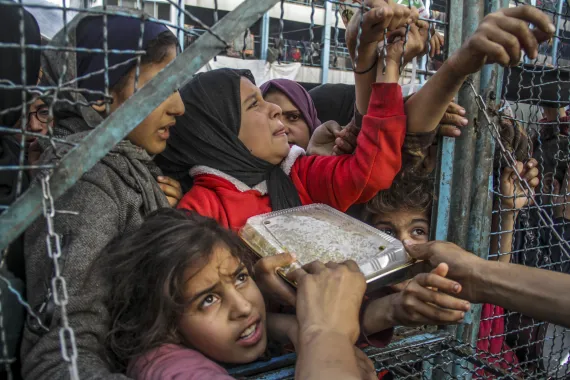 Hungry people of Gaza showing their hunger at the time of food distribution.