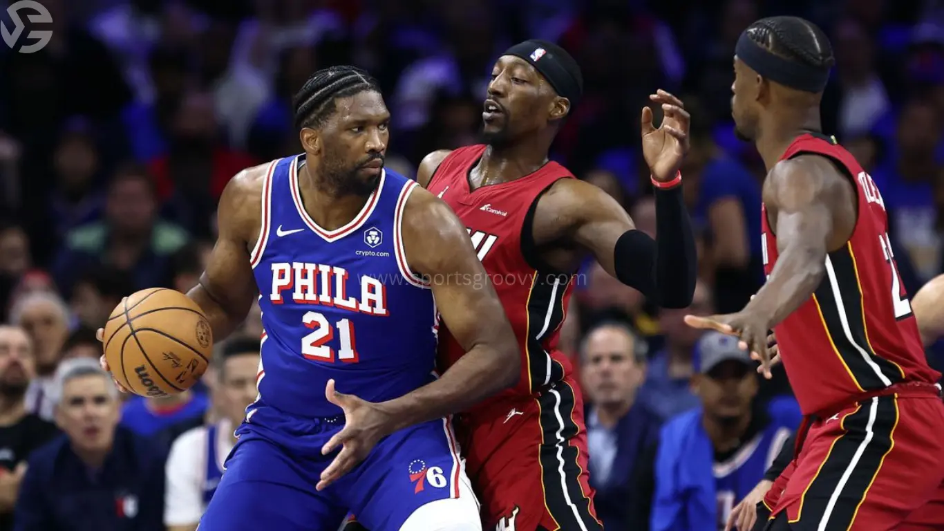 Embiid's dominant performance: 23 points, 15 rebounds, and a crucial assist to Oubre Jr. seals 76ers' 105-104 victory over Miami Heat in Eastern Conference play-in tournament.