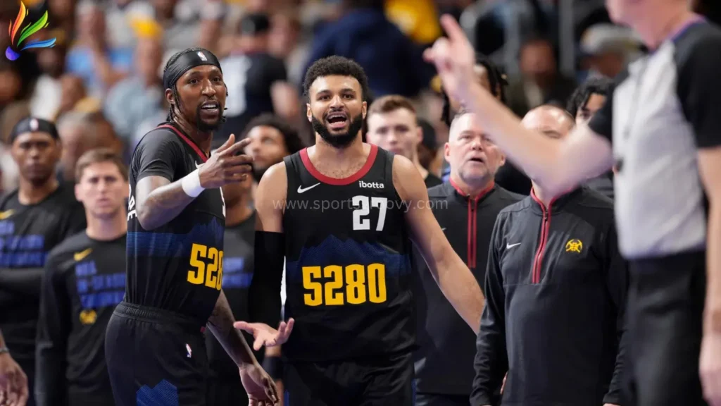 Jamal Murray cheering after making a shot in basket.