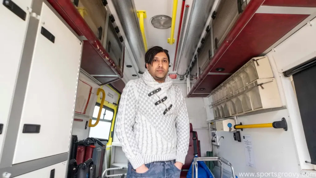 Student UmranALi Javed is standing in his Ambulance which purchased for help civilians in Gaza. 