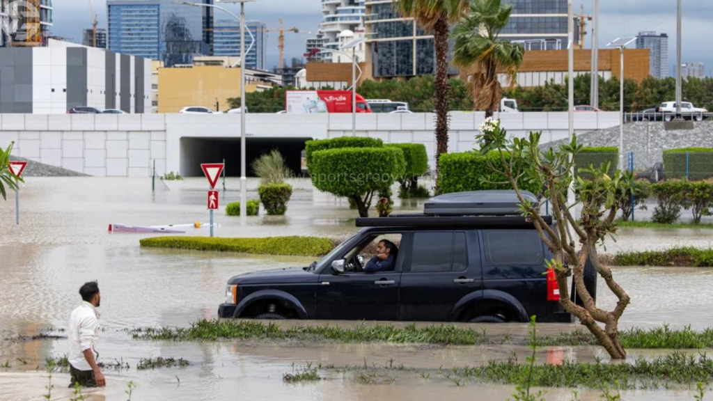 Cars drive through a flooded street in Dubai, United Arab Emirates, Tuesday.