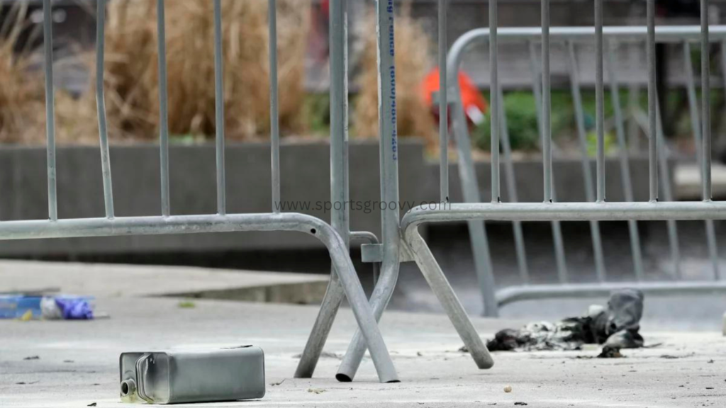 A metal can sits on the ground at the scene where a man lit himself on fire in a park outside Manhattan criminal court on Friday in New York.