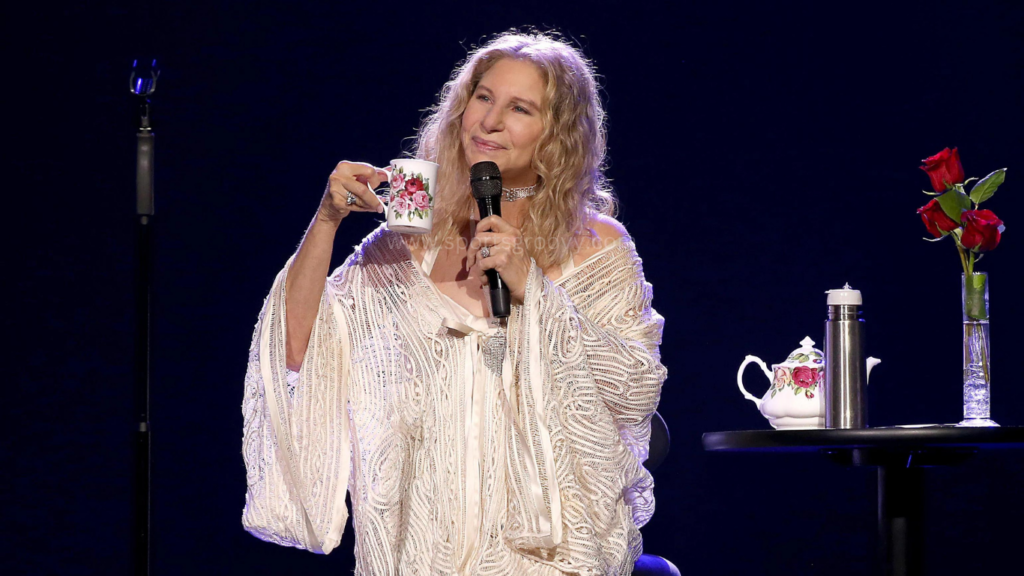 Barbra Streisand with a mug in her hand.