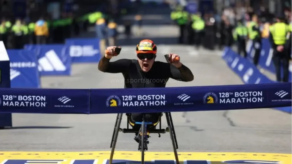 Eden Rainbow Cooper, of Britain, breaks the tape to win the women's wheelchair division at the Boston Marathon. Eden Rainbow Cooper, of Britain, breaks the tape to win the women's wheelchair division at the Boston Marathon.