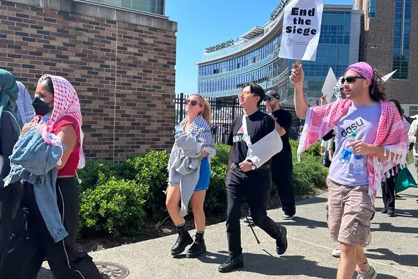 Dozens walk out of university commencement ceremony in protest against comedian's vocal support for Israel.