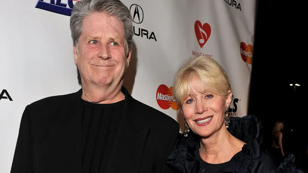 Musician Brian Wilson, left, and his wife Melinda Ledbetter Wilson arrive at the 55th annual Grammy Awards on Sunday, Feb. 10, 2013, in Los Angeles. A judge found Thursday that Beach Boys founder and music luminary Brian Wilson should be in a court conservatorship to manage his personal and medical decisions because of what his doctor calls a “major neurocognitive disorder.”