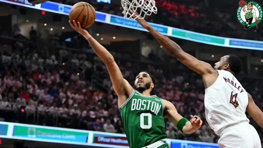 Jayson Tatum (#0) of the Boston Celtics drives to the basket against Evan Mobley (#4) of the Cleveland Cavaliers during the first quarter in Game 4 of the Eastern Conference Second Round Playoffs at Rocket Mortgage Fieldhouse on May 13, 2024 in Cleveland, Ohio.