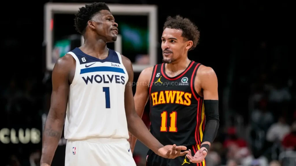 Minnesota Timberwolves guard Anthony Edwards (1) reacts with Atlanta Hawks guard Trae Young (11) during the second half at State Farm Arena.