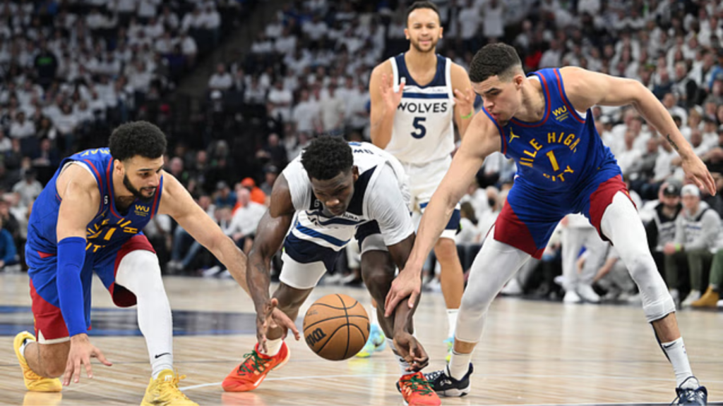 Anthony Edwards (5) of the Minnesota Timberwolves reacts to fouling Jamal Murray (27) of the Denver Nuggets during the second quarter at Target Center in Minneapolis, Minnesota on Friday, May 10, 2024.