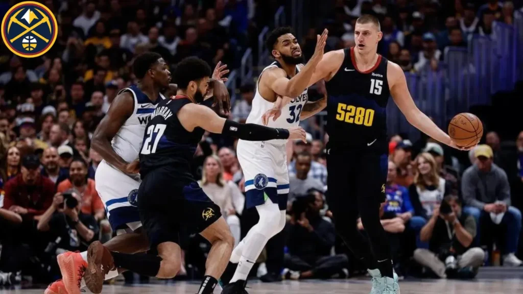 Denver Nuggets center Nikola Jokic shoots over Minnesota Timberwolves center Rudy Gobert during the first half of Game 5 of an NBA basketball second-round playoff series Tuesday, May 14, 2024, in Denver.