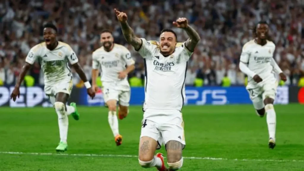 Santiago Bernabeu, Madrid, Spain - May 8, 2024 Real Madrid's Joselu celebrates scoring their first goal as Bayern Munich's Manuel Neuer looks dejected.