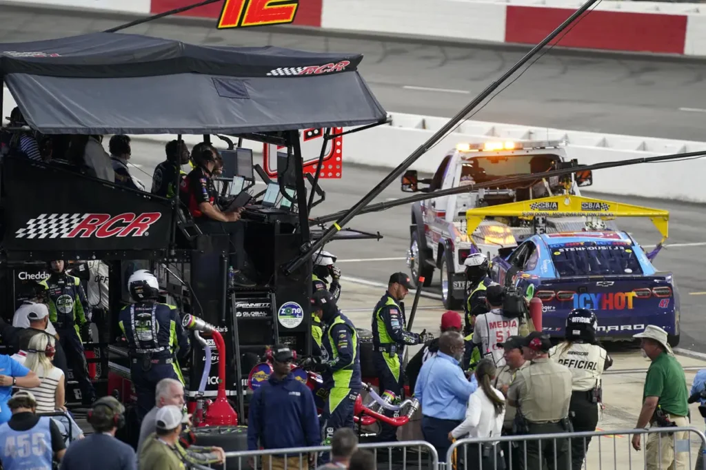 Stenhouse Jr.'s car landed in Busch's pit after an on-track incident at the NASCAR Cup Series All-Star Race.