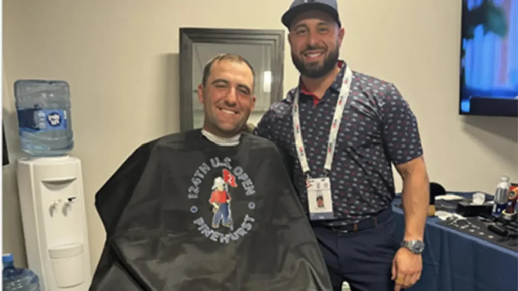 Scotti Scheffler at Barber sitting for his hair cut.