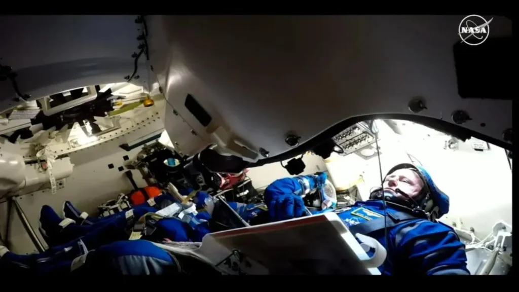 In this screenshot from video footage, Williams and Wilmore can be observed during the launch preparations aboard the Starliner capsule.